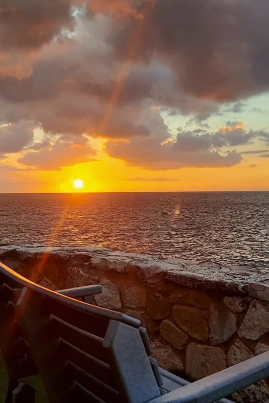 Cliffside seating overlooking the Caribbean Sea at Home Sweet Home Resort