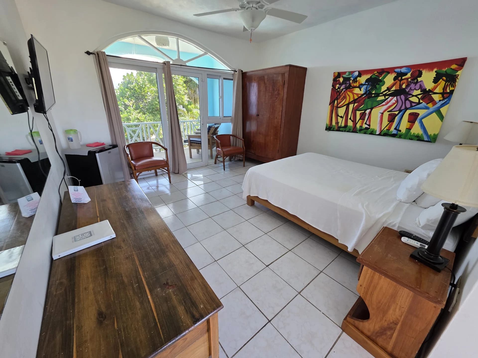 Queen bed with sea-view balcony doors in Seaview Deluxe Queen Room 10